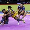 Bengal Warriors (in Blue) and Telugu Titans players in action during the 7th season of pro Kabaddi League