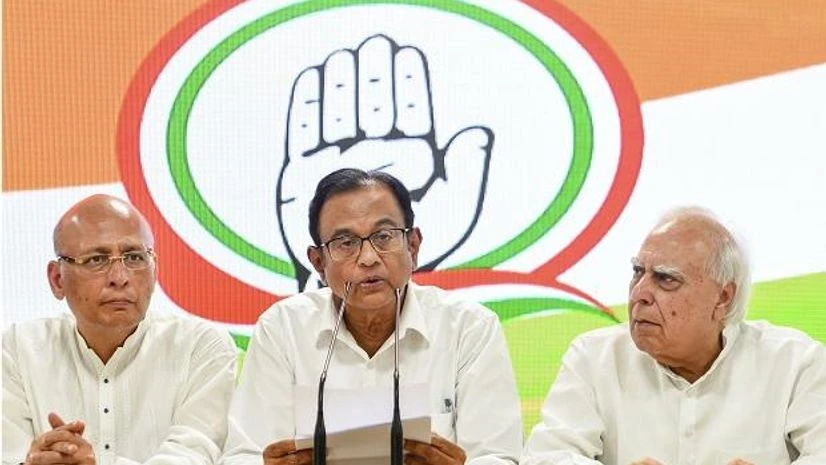Congress leader P Chidambaram addressing a press conference with party leaders Kapil Sibal and Abhishek Singhvi at AICC HQ, in New Delhi on Wednesday | Photo: PTI Congress leader P Chidambaram addressing a press conference with party leaders Kapil Sibal and Abhishek Singhvi at AICC HQ, in New Delhi on Wednesday | Photo: PTI