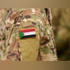 Sudan flag on soldiers arm Sudan flag on soldiers arm