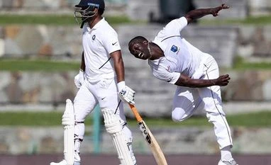 WI pacer Kemar Roach equals Michael Holding's tally of 249 test wickets Kemar Roach during India vs West Indies 1st test