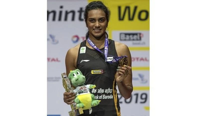 PV Sindhu after winning her women's singles final match against Japan's Nozomi Okuhara at theBasel in Basel, Switzerland, Sunday, Aug. 25, 2019. (Photo:AP/PTI) PV Sindhu after winning her women's singles final match against Japan's Nozomi Okuhara at theBasel in Basel, Switzerland, Sunday, Aug. 25, 2019. (Photo:AP/PTI)