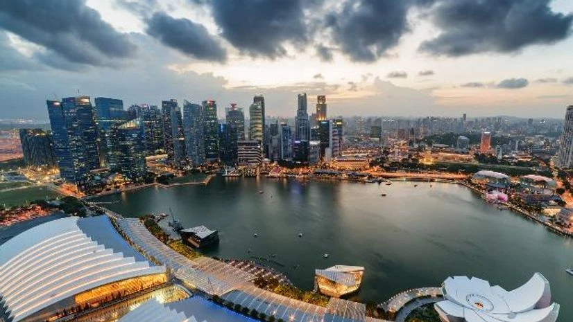 Aerial view of Marina Bay and skyscrapers of downtown in evening at Singapore Aerial view of Marina Bay and skyscrapers of downtown in evening at Singapore