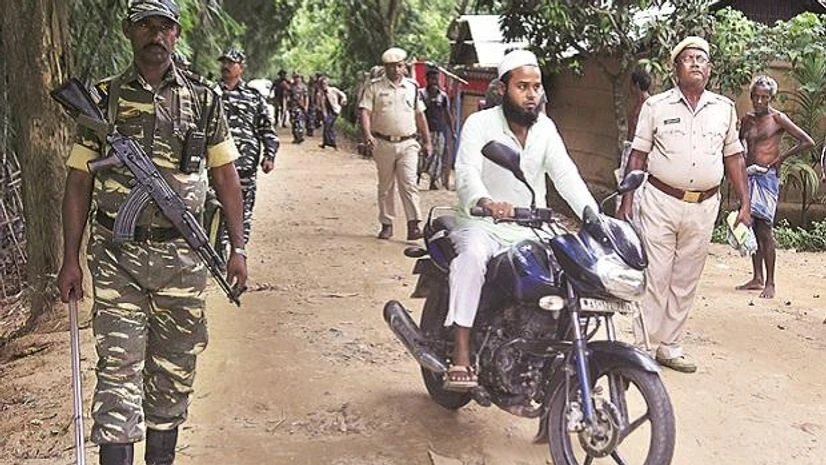 Security personnel patrol on a road in Kachari Para, in Hojai district of Assam, ahead of the publication of the final draft of the NRC on Friday Photo: Reuters Security personnel patrol on a road in Kachari Para, in Hojai district of Assam, ahead of the publication of the final draft of the NRC on Friday Photo: Reuters