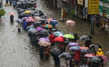Mumbai's Andheri subway to shut from July 21 to Sep 30 b/w 10 pm and 6 am People wade through a flooded street during heavy rain, in Mumbai