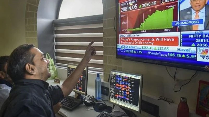 Investors react as they watch the stock prices on a digital screen, at BSE building in Mumbai, Friday, Sept. 20, 2019. Sensex surges 1,921.15 pts to end at 38,014.62; Nifty zooms past 11,200 after Finance Minister Nirmala Sitharaman announced a slew Investors react as they watch the stock prices on a digital screen, at BSE building in Mumbai, Friday, Sept. 20, 2019. Sensex surges 1,921.15 pts to end at 38,014.62; Nifty zooms past 11,200 after Finance Minister Nirmala Sitharaman announced a slew