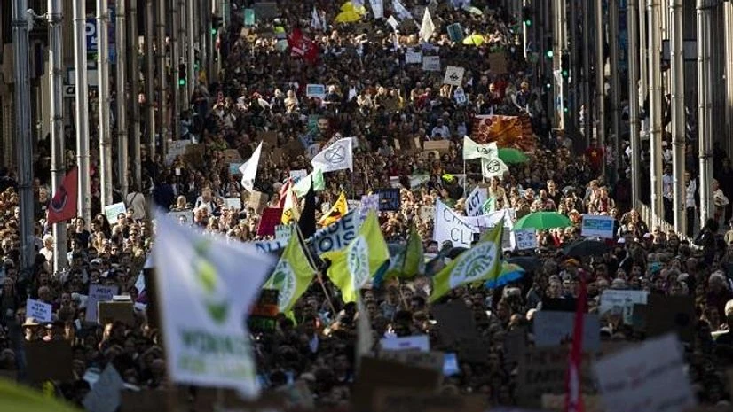 Thousands crowd main De la Loi street as they march during a climate protest in Brussels, Friday, Sept. 20 Thousands crowd main De la Loi street as they march during a climate protest in Brussels, Friday, Sept. 20