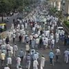 Bhartiya Kisan Sangathan members march towards Delhi for completion of their demands, in Noida. Photo: PTI