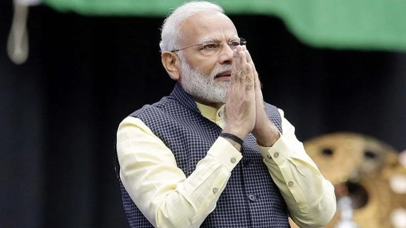 Prime Minister Narendra Modi acknowledges the crowd as he takes the stage during the "Howdi Modi" event at NRG Stadium in Houston. Photo: AP | PTI Modi