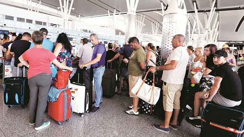 Passengers are seen at Thomas Cook check-in points at Enfidha-Hammamet International Airport, Tunisia | Photo: Reuters Passengers are seen at Thomas Cook check-in points at Enfidha-Hammamet International Airport, Tunisia | Photo: Reuters