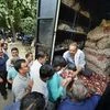 People queue up to purchase onions at subsidised rates at Krishi Bhawan. Prices have soared over the past month	PTI