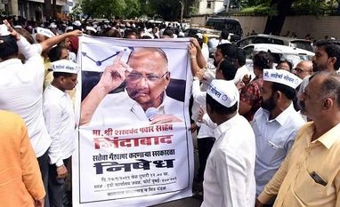 Surprised over Sharad Pawar's name figuring in MSCB scam case: Anna Hazare NCP party workers raise slogans during a protest outside ED office. Photo: Kamlesh Pednekar