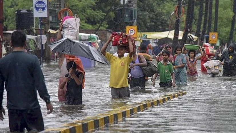 floods, waterlogging Residents of Rajendra Nagar area relocate to a safer place with their belongings as their houses gets flooded following heavy monsoon rainfall, in Patna, Sunday, Sept. 29, 2019