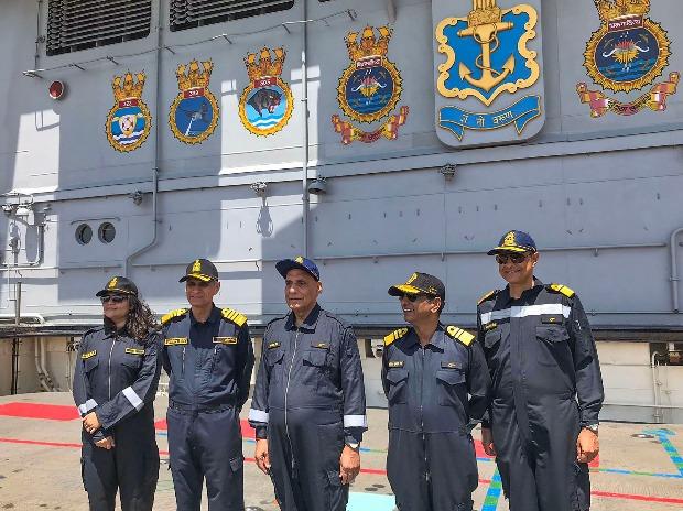 Rajnath Singh flanked by Indian Navy personnel Rajnath Singh flanked by Indian Navy personnel