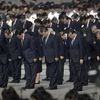Chinese President Xi Jinping, center, and other officials bow during a ceremony to mark Martyr's Day at Tiananmen Square in Beijing (Photo: AP/PTI)