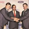 Jim Farley, president of Ford’s new businesses, with M&M MD Pawan Goenka and Mahindra Group Chairman Anand Mahindra at a news conference in Mumbai. (Photo: PTI)