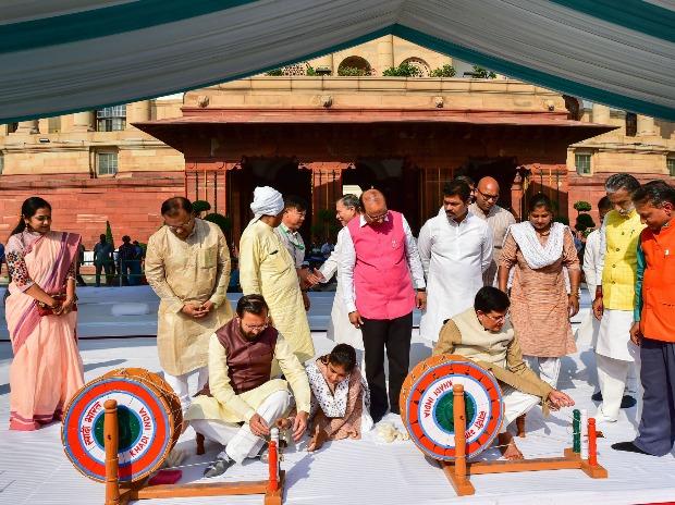 Union Ministers Piyush Goyal and Prakash Javadekar try their hands on a spinning wheel Union Ministers Piyush Goyal and Prakash Javadekar try their hands on a spinning wheel