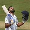 Rohit Sharma celebrates his century on the 1st day of the first cricket test match against South Africa. Photo: PTI