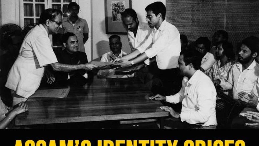 ASSAM’S TRYST: Union Home Secretary Ram D Pradhan handing over a copy of the signed accord to Assamese leaders on August 15, 1985, as Prime Minister Rajiv Gandhi (second from left) looks on. Indian Express Archive ASSAM’S TRYST: Union Home Secretary Ram D Pradhan handing over a copy of the signed accord to Assamese leaders on August 15, 1985, as Prime Minister Rajiv Gandhi (second from left) looks on. Indian Express Archive