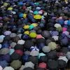 Protesters holding umbrellas take part in a march in Hong Kong, Sunday, Oct. 6, 2019. A group of pro-democracy Hong Kong legislators filed a legal challenge against the government's use of a colonial-era emergency law to criminalize the wearing of ma
