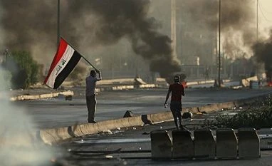 Iraq protesters attack US embassy over strikes on pro-Iran fighters Baghdad: Anti-government protesters set fires and close a street during a demonstration in Baghdad, Iraq, Saturday, Oct. 5, 2019. Iraqi protesters pressed on with angry anti-government rallies across several provinces, in some cases torching party of