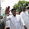 Premadasa, Sri Lanka's housing minister and deputy leader of the ruling United National Party waves at his supporters as he leaves after handing over nominations papers at the election commission ahead of Sri Lanka's presidential