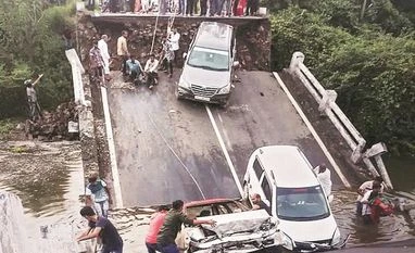 60-feet-long bridge collapses in Gujarat's Junagadh district, four injured Vehicles stuck in the gaps after slabs of a 60-feet-long bridge collapsed in Junagadh district, Gujarat. Photo: PTI