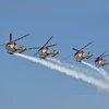 IAF's Sarang helicopter display team leaves for Bahrain Int'l Air Show Ghaziabad: IAF helicopters 'Sarang' perform during the 87th Indian Air Force Day celebrations at Hindon Airbase, in Ghaziabad, Tuesday, Oct. 8, 2019. (PTI Photo/Vijay Verma) (