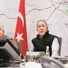 Turkish Defence Minister Hulusi Akar (centre) at army headquarters in Ankara