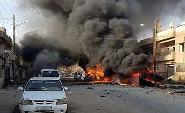 India urges UNSC to assess cost of 'actions and inactions' in Syria Qamishli: This photo by Hawar news, the news agency for the semi-autonomous Kurdish areas in Syria (ANHA), shows flames rising from burned cars at the site of an explosion in the central Qamishli