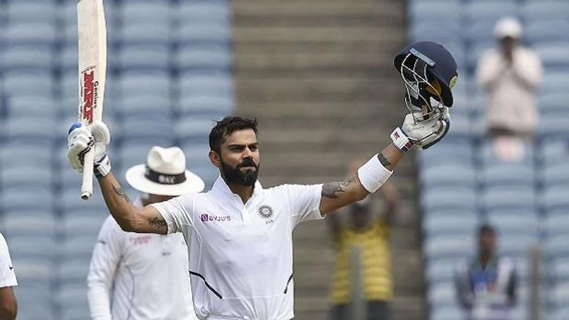 Pune: Indian cricket team Captain Virat Kohli raises his bat after scoring a century on the day 2 of second India-South Africa cricket test match, at Maharashtra Cricket Association Stadium in Pune, Friday, Oct. 11, 2019. (PTI Photo/Mitesh Bhuvad) ( Gambhir explains why Aus tour will be different for Kohli and Co this time