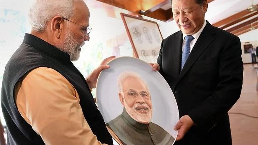 Modi, xi jinping Prime Minister Narendra Modi and Chinese President Xi Jinping exchange gifts, at Mamallapuram , Saturday