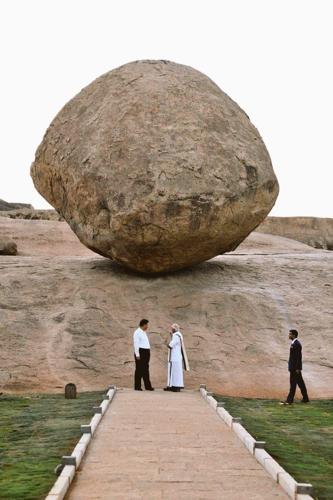 Modi and Xi standing before Krishna's Butter Ball, a 20-foot rock weighing about 250 tons. Modi and Xi standing before Krishna's Butter Ball, a 20-foot rock weighing about 250 tons.