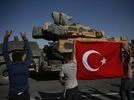 Turkey, Turkish Army Local residents applaud as a convoy of Turkish forces trucks transporting tanks is driven in Sanliurfa province, southeastern Turkey, at the border with Syria, Saturday, Oct. 12, 2019 | Photo: AP/PTI