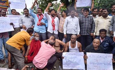 Hyderabad: Agitating Telangana State Road Transport Corporation (TSRTC) get their heads tonsured during their ongoing strike, in Hyderabad, Wednesday, Oct. 16, 2019 Hyderabad: Agitating Telangana State Road Transport Corporation (TSRTC) get their heads tonsured during their ongoing strike, in Hyderabad, Wednesday, Oct. 16, 2019