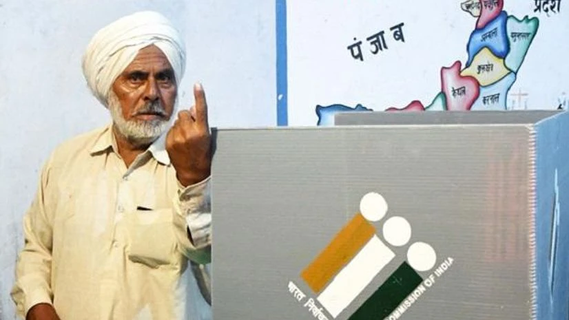 First voter Ajjaib Singh shows his finger after casting vote in Khurkara polling station in Ambala constituency Eelection Commission to announce schedule of bypolls at appropriate time