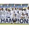 Indian captain Virat Kohli and team players pose with the trophy after winning the Test series against South Africa at JSCA Stadium, in Ranchi. Photo: PTI