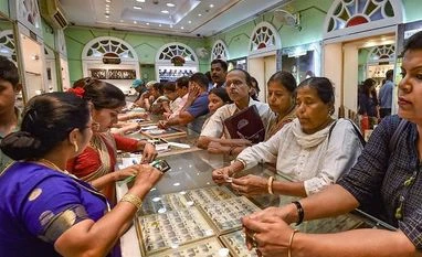 Should you buy gold and silver this Dhanteras as prices touch all-time high Women buy gold ornaments on the occasion of 'Dhanteras' festival at a shop in Kolkata