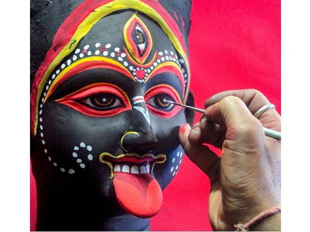 A clay artist gives finishing touches on an idol of goddess Kali ahead of Diwali A clay artist gives finishing touches on an idol of goddess Kali ahead of Diwali