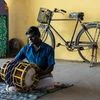Thavil: A musician uses the instrument