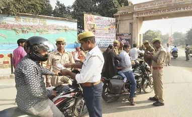 Ayodhya verdict: Bhopal admin cancels permission to rally till Nov 30 Ayodhya: Security personnel check commuters at the entrance of the city of Ayodhya, Ayodhya, Saturday, Nov. 9, 2019