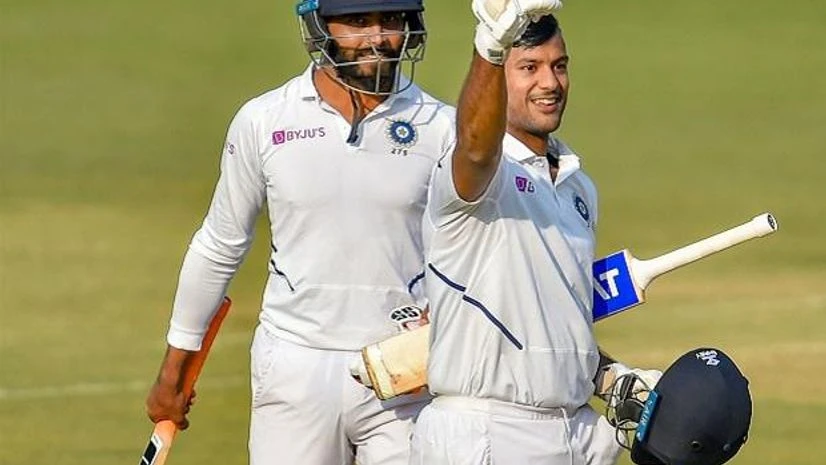 Mayank Agarwal, Ravindra Jadeja Indian batsman Mayank Agarwal displays a victory sign after scoring a double century on the second day of the first cricket test match against Bangladesh, in Indore. Photo: PTI