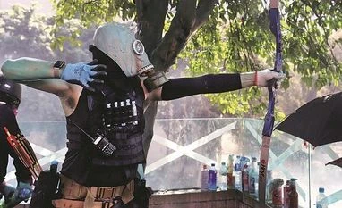 Hong Kong police officer hit by arrow as protesters dig in at campus hong kong protest