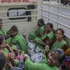 Workers depart in a truck from the Daimler India Commercial Vehicles Pvt. manufacturing facility in the Oragadam district of Chennai. (Photo source: Bloomberg)