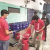 Workers loading and doing quality checks at Zomato’s warehouse in Samalkha, Haryana