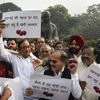 Congress leaders P Chidambaram, Adhir Ranjan Chowdhury and others stage a protest against hike in onion prices at Parliament during the ongoing Winter session, in New Delhi, Thursday, Dec. 5, 2019. (PTI Photo/Kamal Singh)