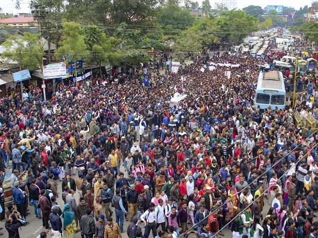 Protestors gather in a street on the outskirts of Sivasagar town in Assam Protestors gather in a street on the outskirts of Sivasagar town in Assam