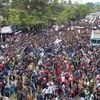 Protestors gather in a street during a protest strike against the Citizenship Amendment Bill on the outskirts of Sivasagar town in Assam. Photo: PTI