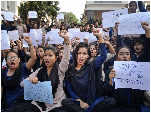 College students raise slogans in protest during a strike in Guwahati College students raise slogans in protest during a strike in Guwahati