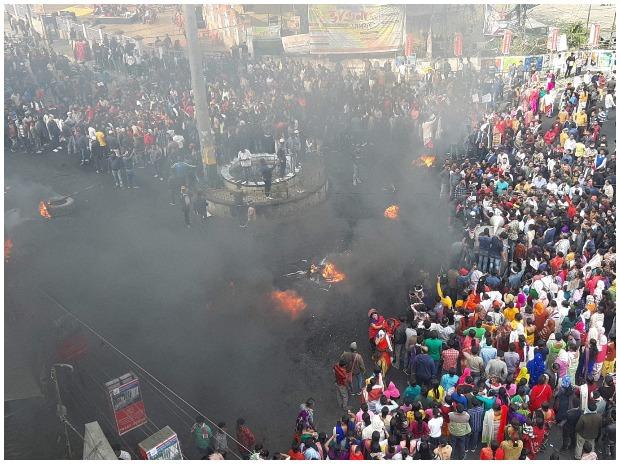 College students along with locals burn tyres in Tinsukia district of Assam College students along with locals burn tyres in Tinsukia district of Assam