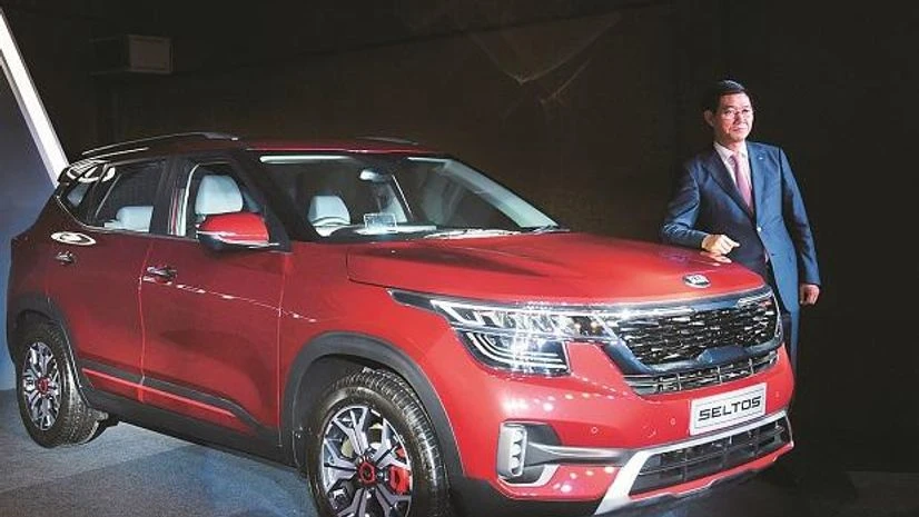 Kia Motors India MD & CEO Kookhyun Shim MD & CEO of Kia Motors India Kookhyun Shim posing with the newly launched Kia Seltos at an event in August. Photo: PTI